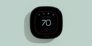 Smart thermostat on a wall with a clean modern design