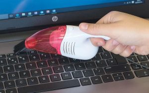 Mini desk vacuum cleaner shaped like a ladybug