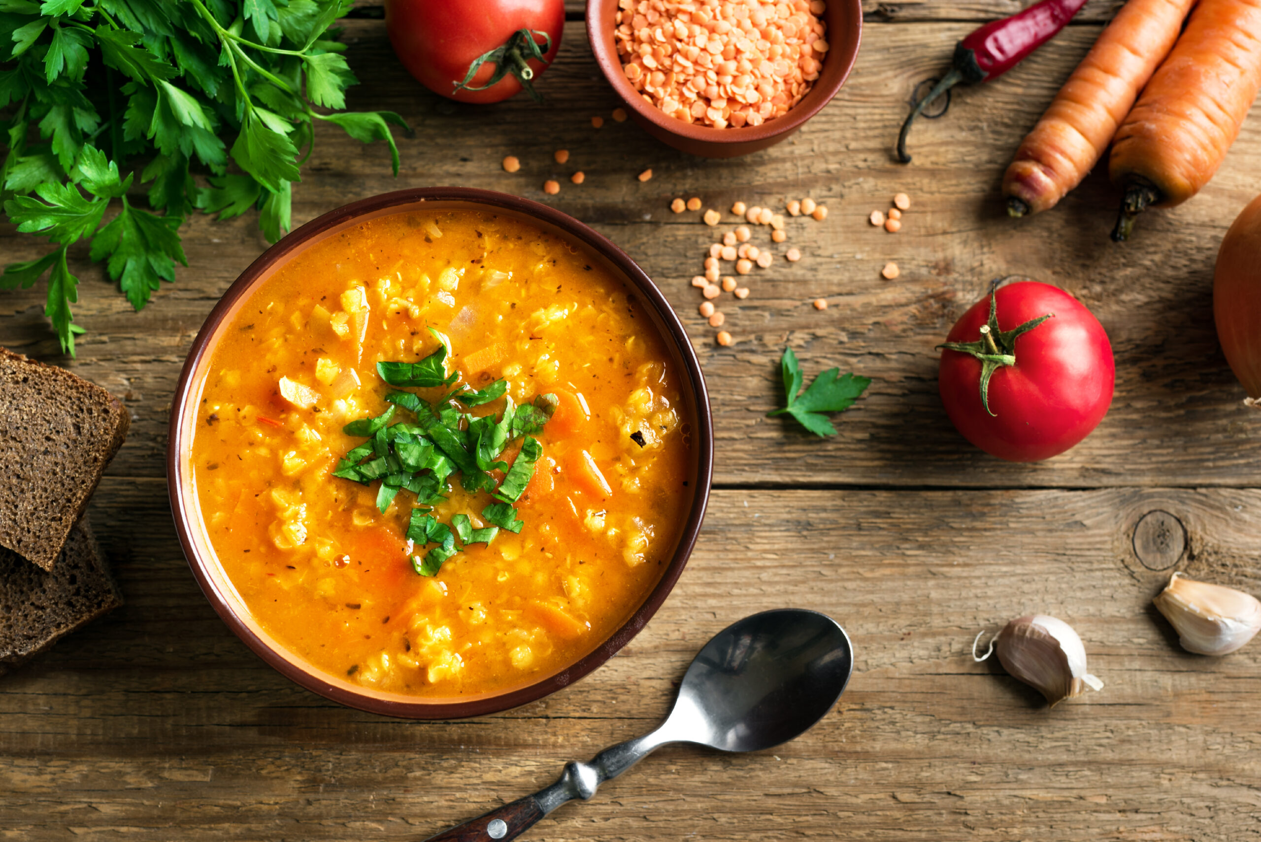 Vegetarian lentil soup with vegetables in a pot