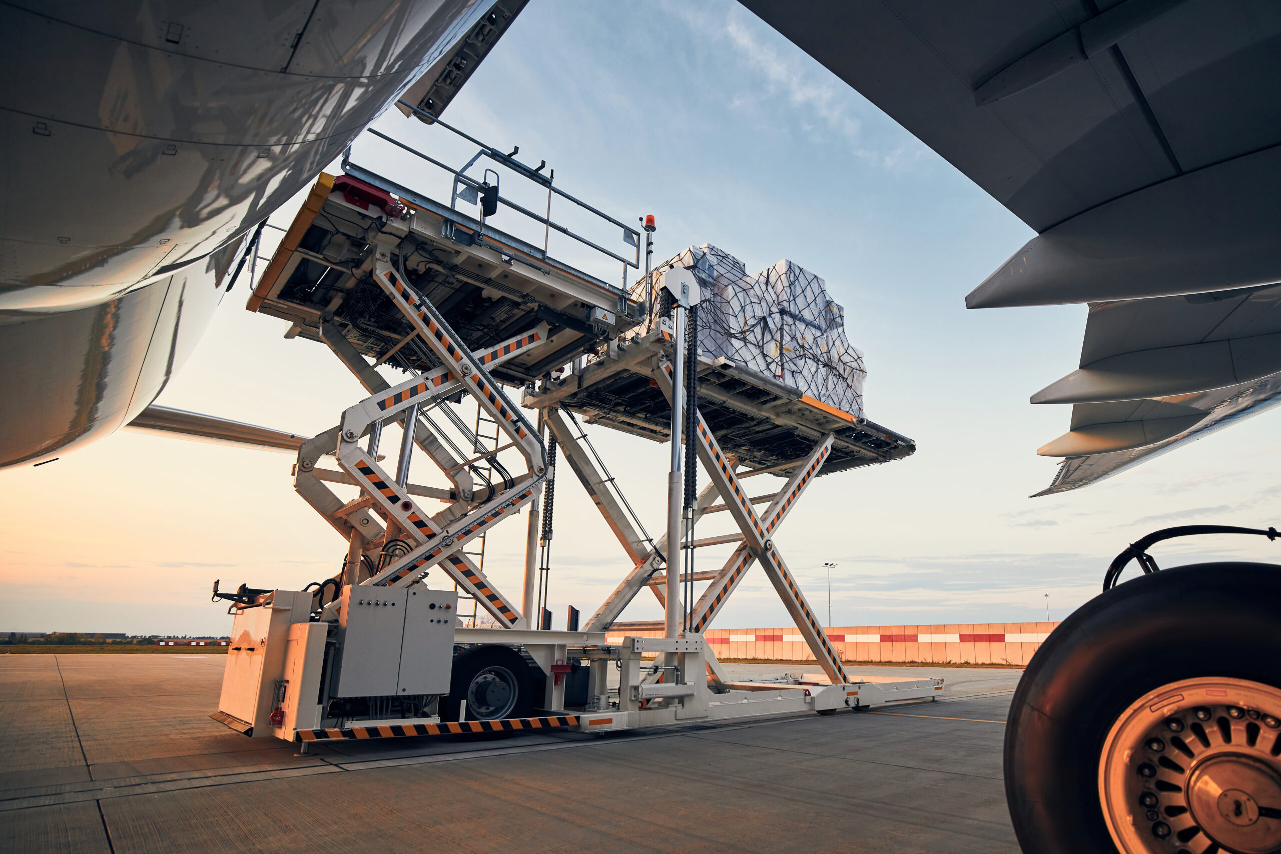 A plane cargo hold door being closed