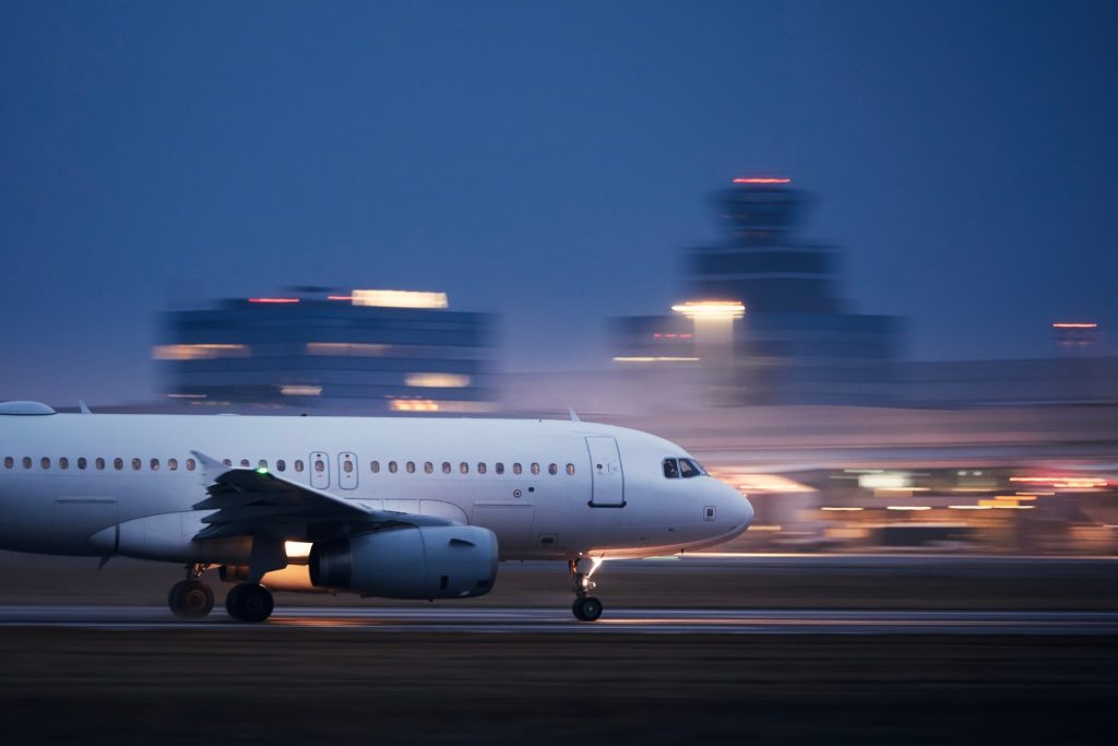 A view of a runway as a plane prepares for takeoff